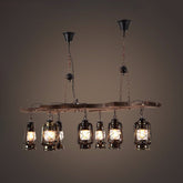 Lámpara de araña lineal industrial vintage de 8 luces con pantalla tipo farol de latón envejecido